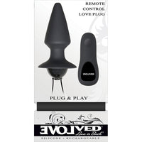Black plug & play vibrating anal plug inside packaging.