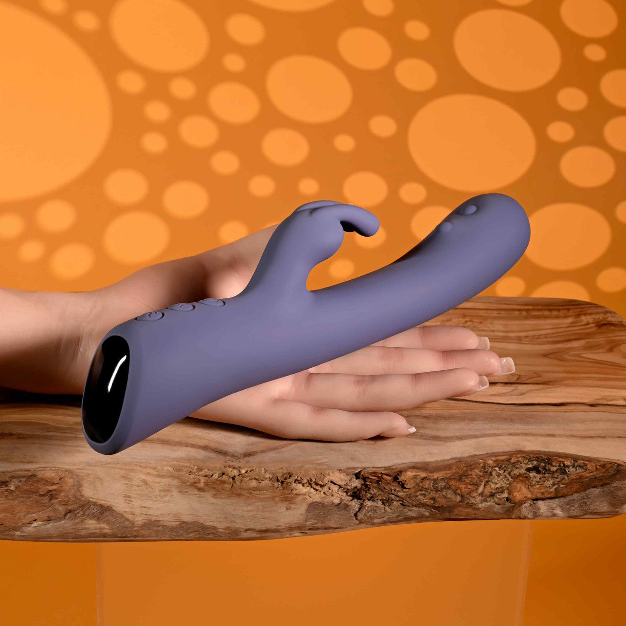 Purple poppin good time vibrator against hand example photo.