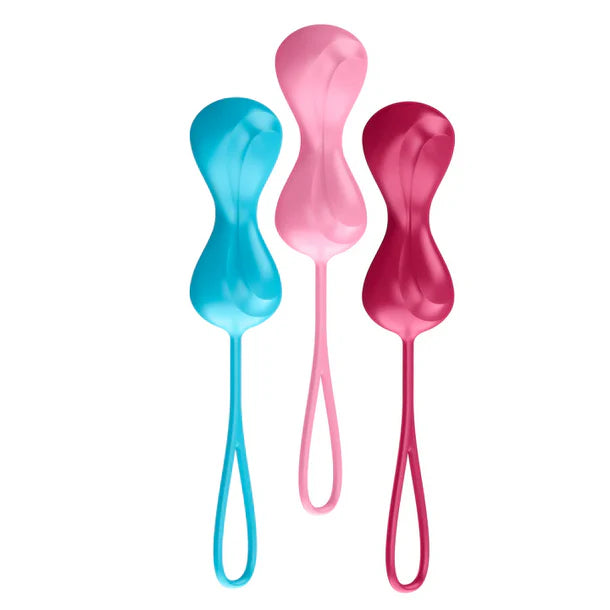 Three colorful kegel balls in blue, pink, and red on a white background