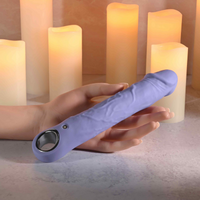 Purple fantasy large vibrator against hand example photo.