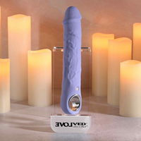 Purple fantasy large vibrator against display case example photo.