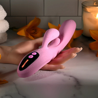 Pink push the button vibrator against hand example photo.
