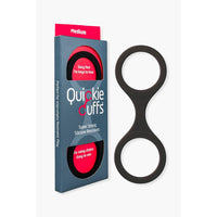 Black super strong medium silicone restraints beside packaging.