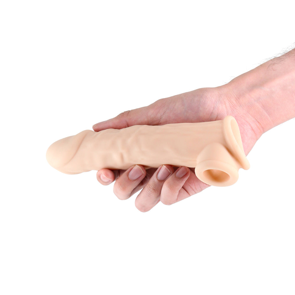 Thin beige penis extension example photo.
