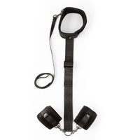 Black neck and wrist restraints example photo.