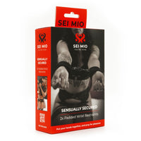 Sensually secured 2pk padded wrist restraints inside packaging.