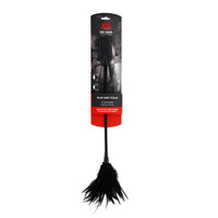 Black dual ended crop and tickle feather inside packaging.
