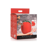 Red shegasm forbidden apple silicone clit stimulator inside packaging.