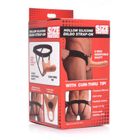 Hollow silicone dildo strap on inside packaging.