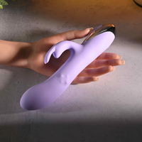 Purple vibrator against hand sizing photo.