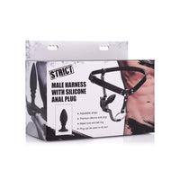 Male harness with anal plug inside packaging.