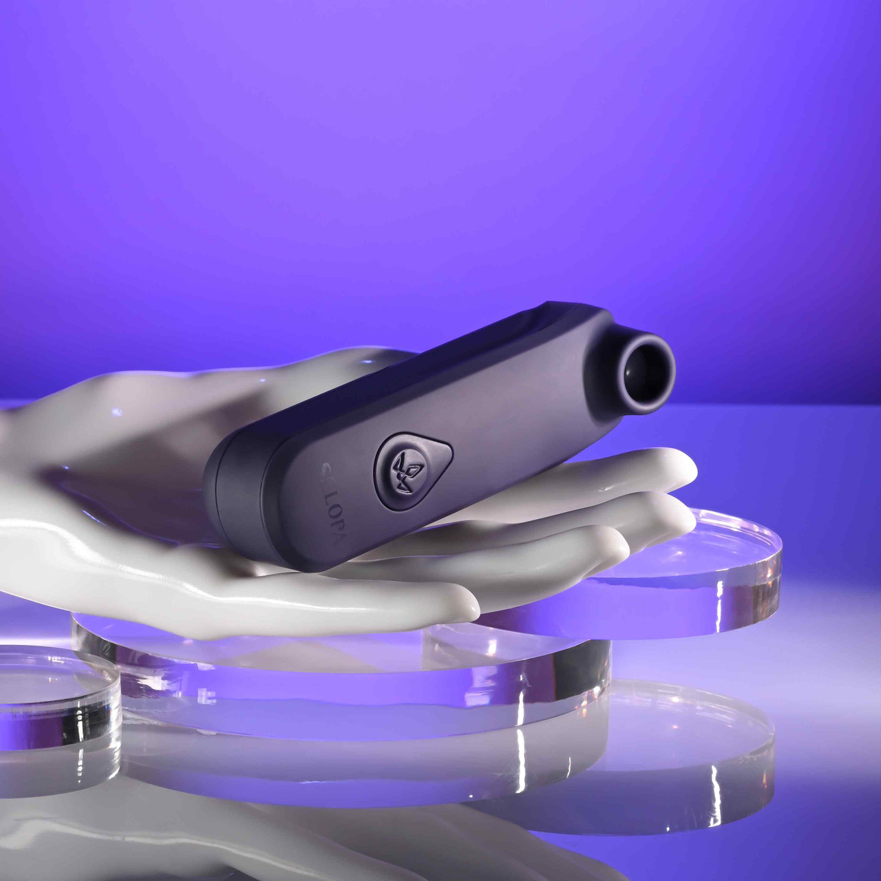 Black clitoral vibrator sizing example photo against hand.