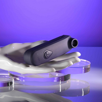 Black clitoral vibrator sizing example photo against hand.