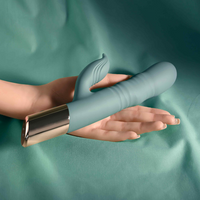 Green the shimmy vibrator against hand sizing photo.