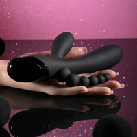 Black triple aces vibrator sizing example photo against hand.