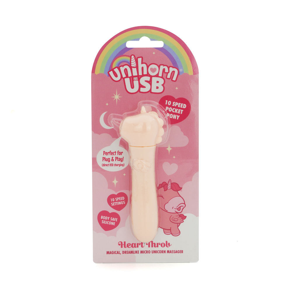 Pink Unihorn heart throb clitoral vibrator inside packaging.