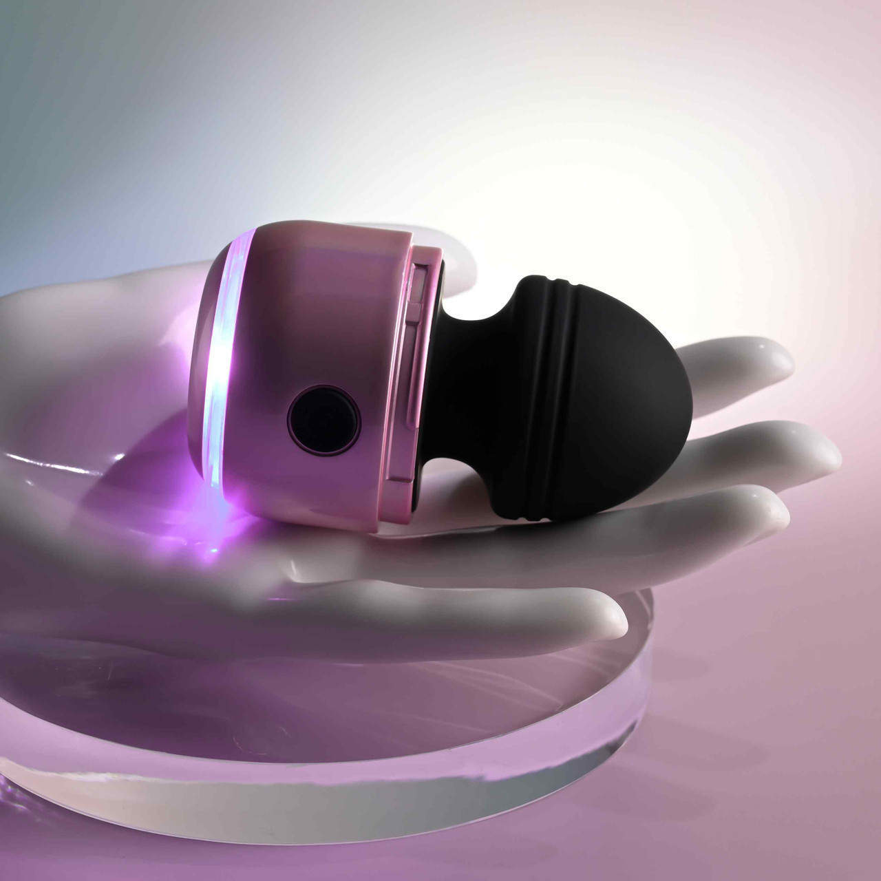 Black vibes vibrator with lights example photo against hand.