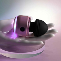 Black vibes vibrator with lights example photo against hand.