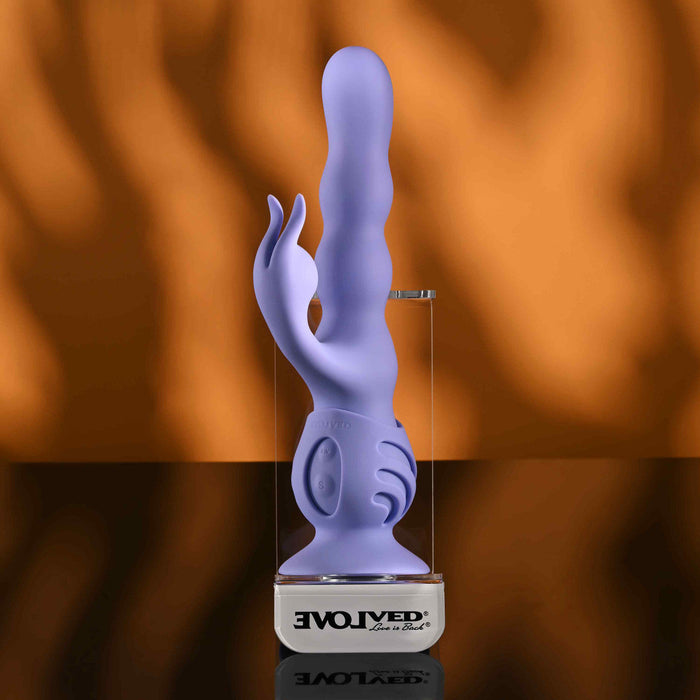 Purple wiggly bunny vibrator against display case example photo.