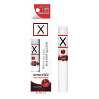 X on the lips lip balm cherry flavored enhanced with pheromones beside packaging.
