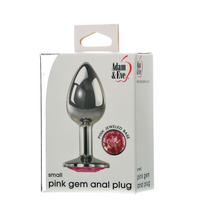 silver metal anal plug with pink gem on bottom. on box packaging