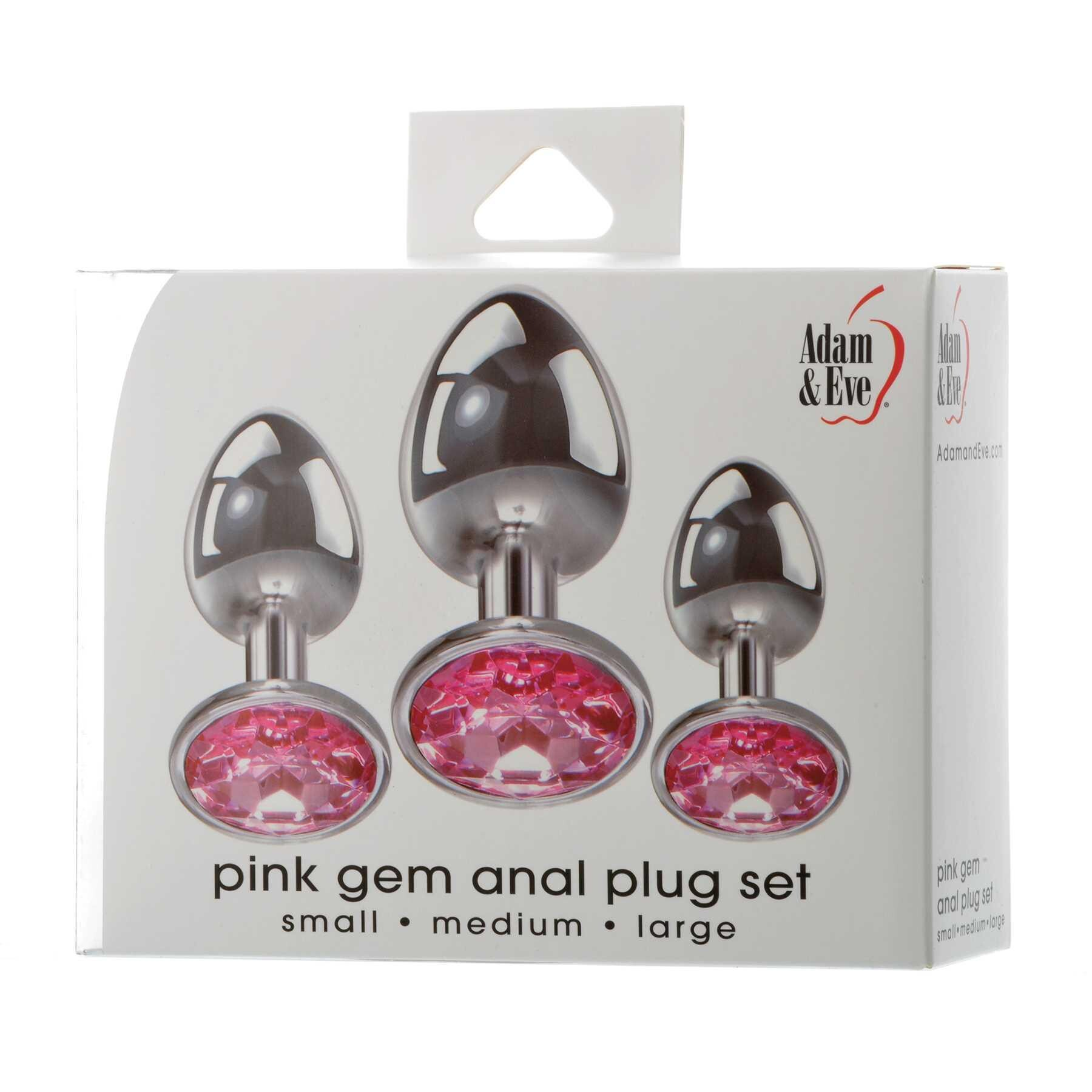 3 silver metal anal plugs with pink gem bottoms on box packaging