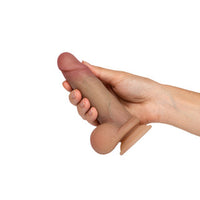realistic dildo held in hand