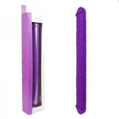 Purple double dildo with packaging on a white background