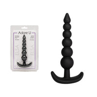 xl black anal plug with beads beside packaging