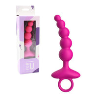 Pink silicone anal plug with packaging on a white background