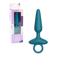 Teal silicone butt plug with packaging on a white background