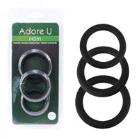 Set of black cock rings with packaging labeled 'Adore U Hom' on a white background