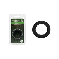 black silicone cock ring beside packaging