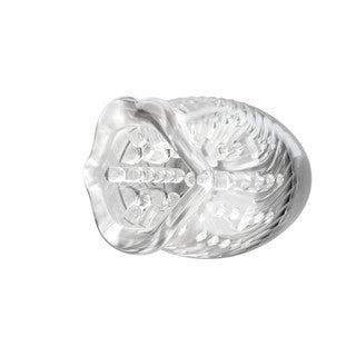 Clear plastic object with intricate design on a white background