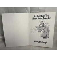 Open birthday card with cartoon character holding breath and humorous text on a gray background