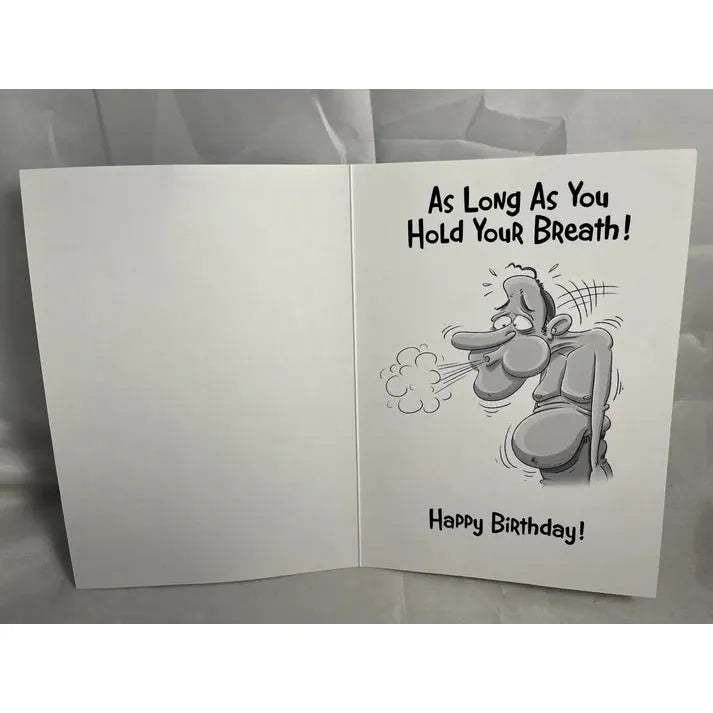 Open birthday card with cartoon character holding breath and humorous text on a gray background