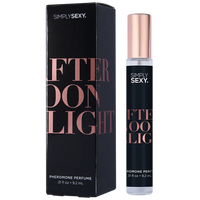 black label, with rose gold writing on clear roll on bottle.  beside black box packaging, afternoon delight scent