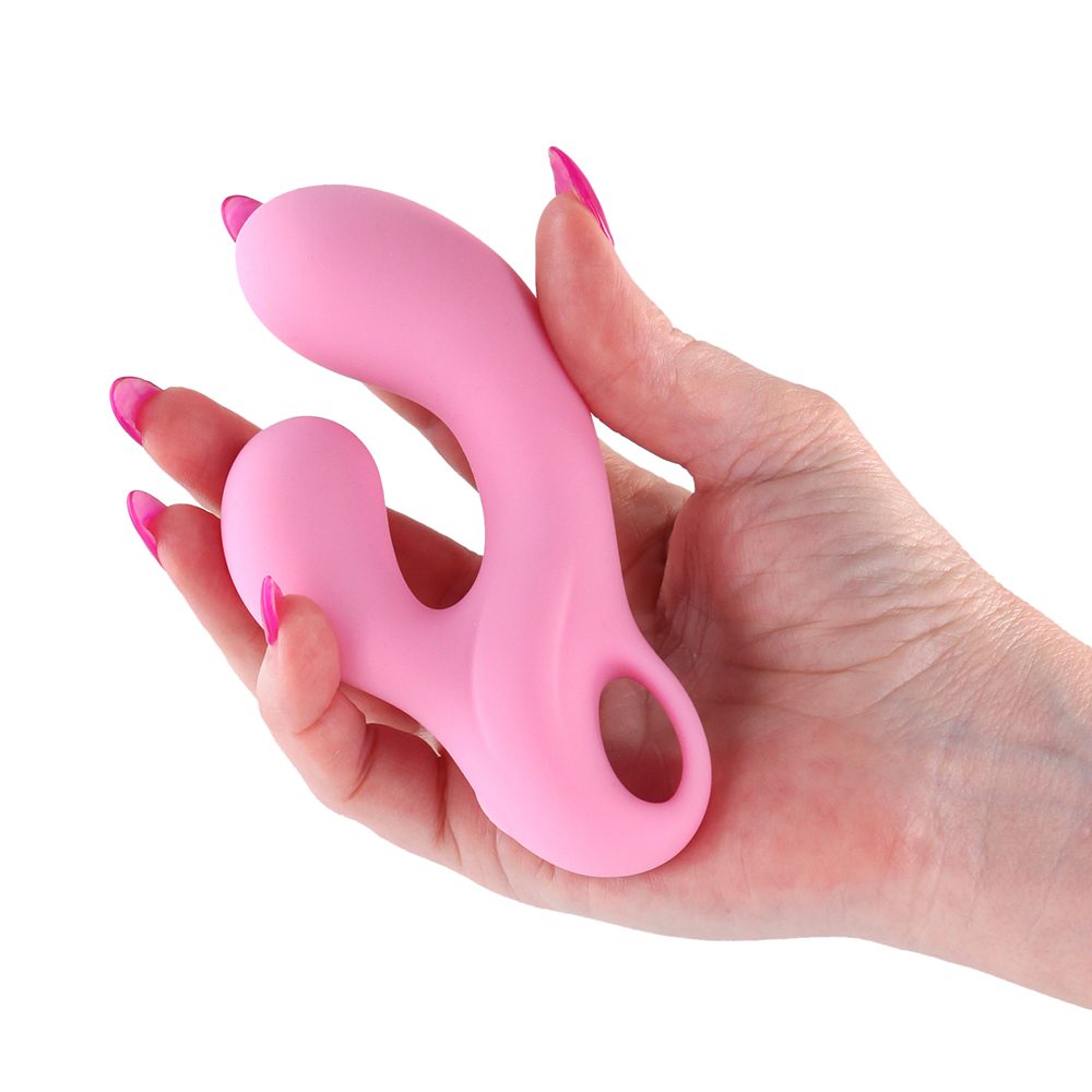 agatha Pink vibrator  held in a hand with pink nail polish on a white background