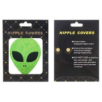 Nipple cover packaging with green alien design on a black background