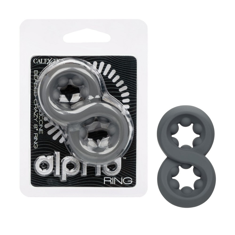 Two dark gray silicone 8-ring toys shown next to their retail blister packaging, which features a black and white design with the brand name 'alpha RING'.