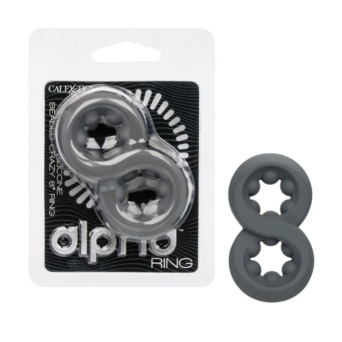 Two dark gray silicone 8-ring toys shown next to their retail blister packaging, which features a black and white design with the brand name 'alpha RING'.