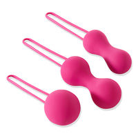 pink 3 piece kegel set all with tails, 1 single ball kegel, and 2 different sized connected dual keegels