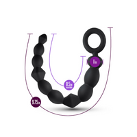 Black silicone ring with measurements on a white background