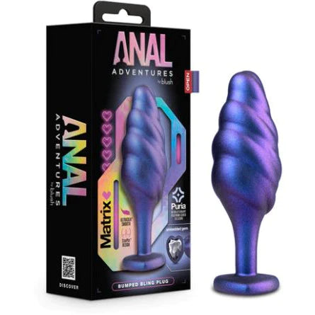 iridescent purple tapered, swirl anal plug next to the product display box 