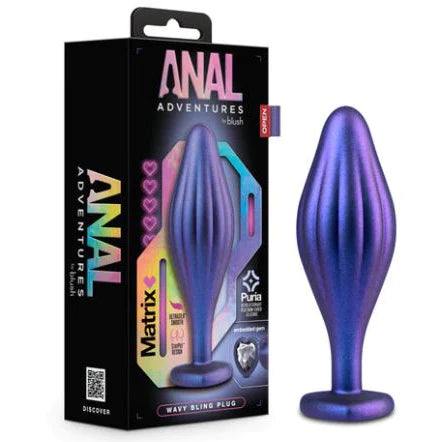 iridescent purple tapered anal plug with vertical waves standing next to the products display box