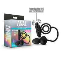 black anal plug with attached vibrating cock ring beside box packaging
