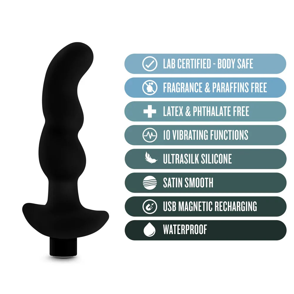 black curved anal plug beside specs