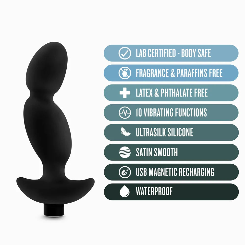black curved anal plug beside specs