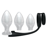 black slicone penis rings with 3 different sized white anal plugs