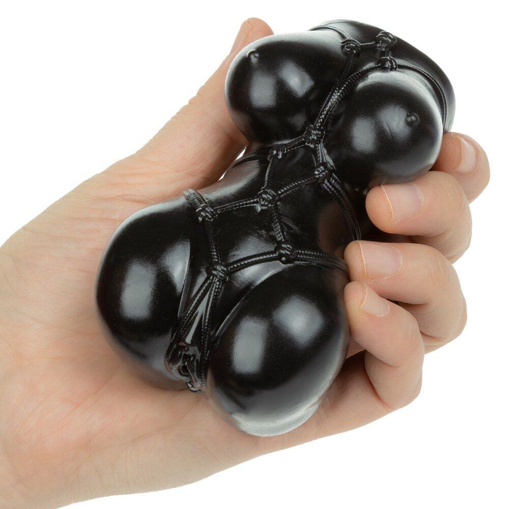 Black amine stroker misty with webbed design held in a hand against a white background